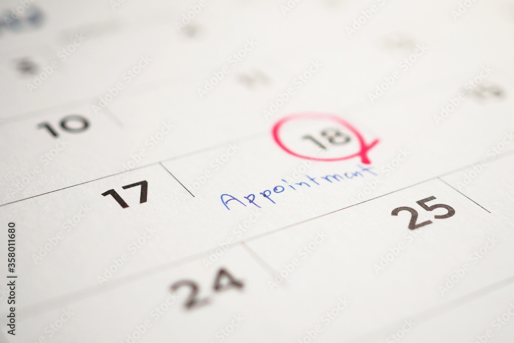 important appointment schedule write on white calendar page date close up important appointment schedule write on white calendar page date close up