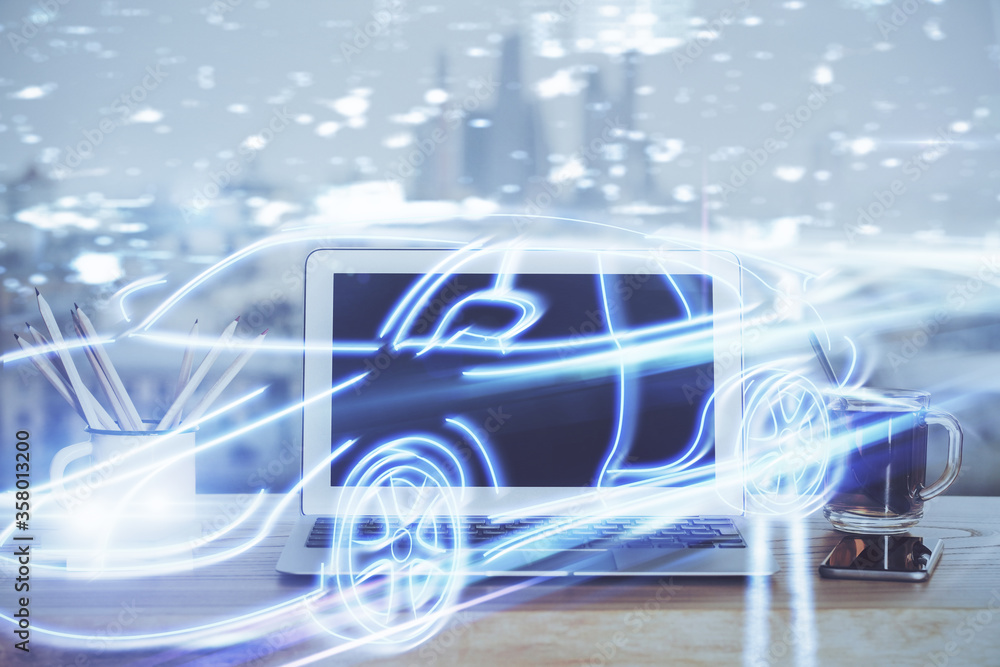 Naklejka premium Desktop computer background in office with automobile hologram drawing. Multi exposure. Tech concept.