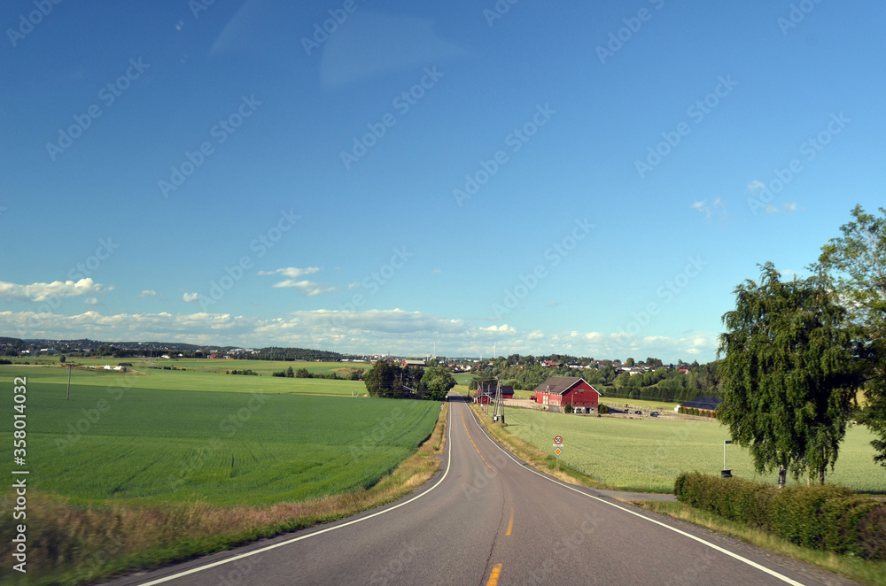 A typical Norwegian road in the countryside.  Ostfold Region, Norway