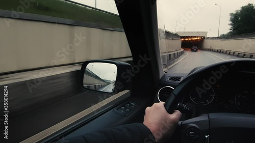 POV: Driving a car on a highway and in a tunnel in the rain. 
Color graded.