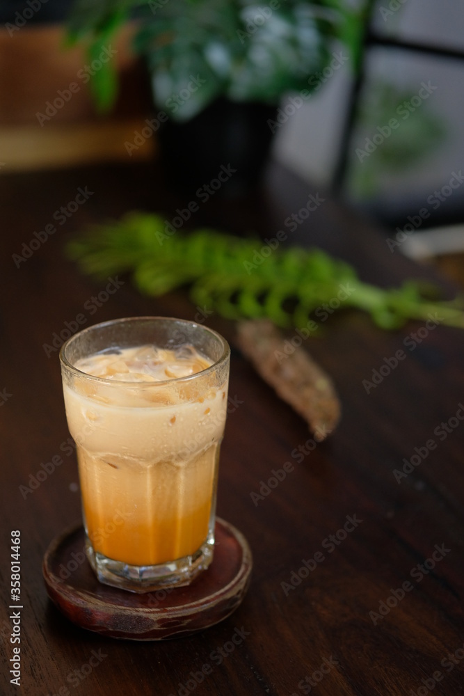 Iced coffee with milk, chocolate syrup and meringues. Isolated Focus Iced coffee with milk, chocolate syrup and meringues. Isolated Focus