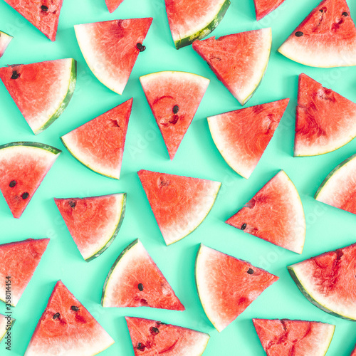Watermelon pattern. Red watermelon on mint background. Summer concept. Flat lay, top view