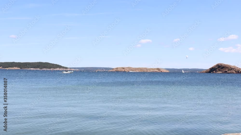 West Coast of Sweden. Blue sea and a sunny day during summer. Small boat is out on the water. 