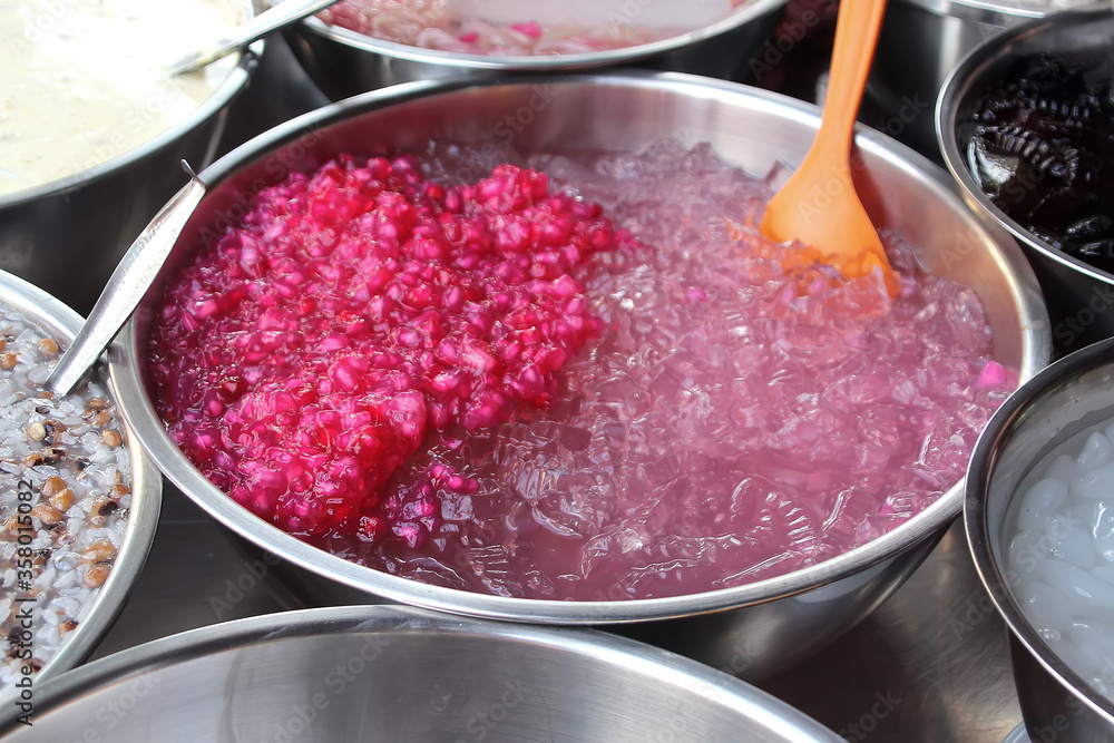 Pomegranate grains lie in an ice basin