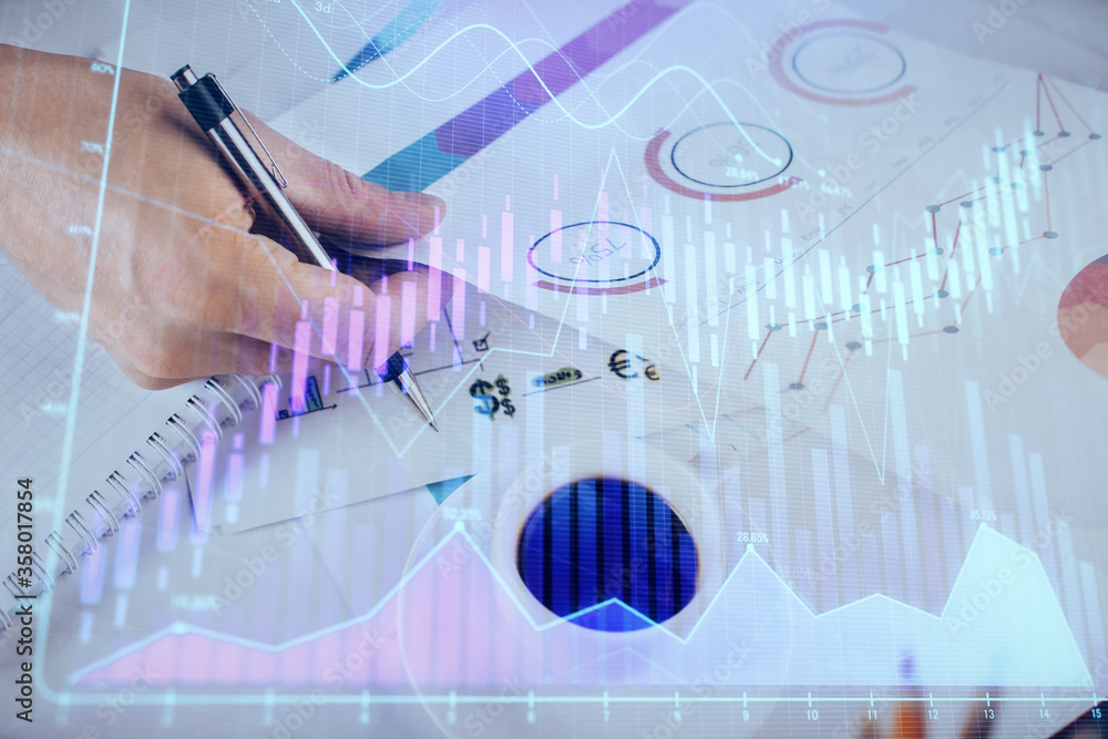 Multi exposure of man planing investment with stock market forex chart. Multi exposure of man planing investment with stock market forex chart.