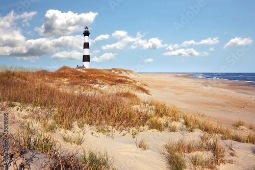 The lighthouse with seashore landscape background in Outerbanks NC  USA. Soft blurry background. 