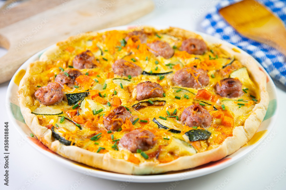French quiche with vegetables and sausage