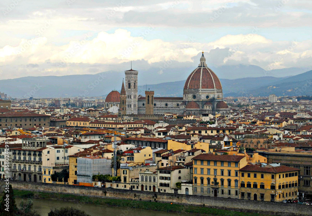 View of the city of Florence on a cloudy day from a hilltop