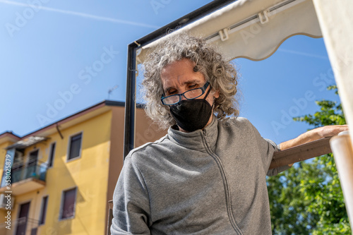 expert craftsman is repairing a balcony awning