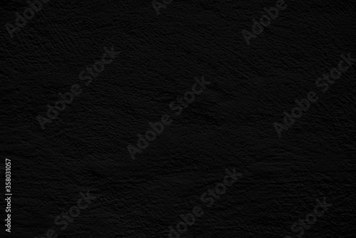 Black stucco texture. Architectural abstract background. Dark wall of building.