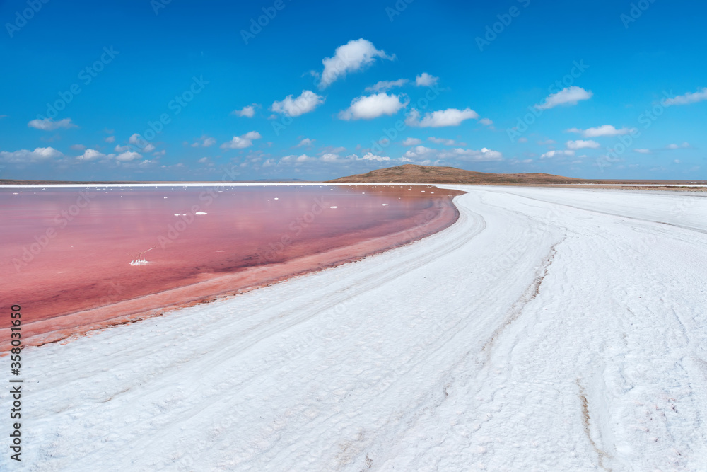 Pink salt lake with white shores. Lake Koyashskoe, Kerch Peninsula, Crimea.