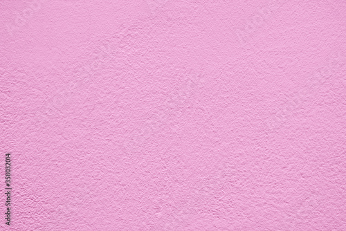 Pink stucco texture. Architectural abstract background. Pink wall of building.