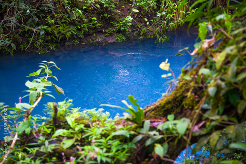 Celestial blue waterfall and pond in volcan Tenorio national park  Costa Rica