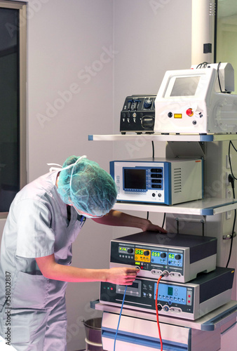 Woman preparing medical laboratory equipment. To analyze technical aspects. Surgery and Medicine