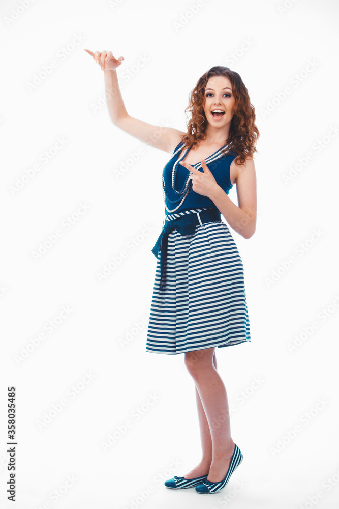 Smiling happy brunette woman pointing with finger and showing size, isolated on white Smiling happy brunette woman pointing with finger and showing size, isolated on white