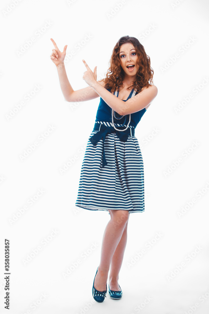 Smiling happy brunette woman pointing with finger aside isolated on white Smiling happy brunette woman pointing with finger aside isolated on white