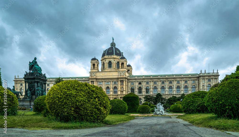 Hoffburg Imperial Palace in Vienna, Austria. Luxurious baroque facade and green summer park