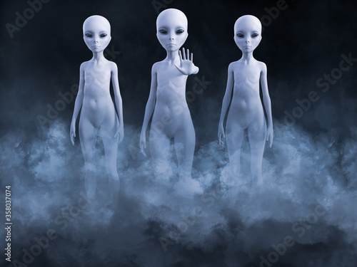 3D rendering of three aliens appearing in smoke. photo