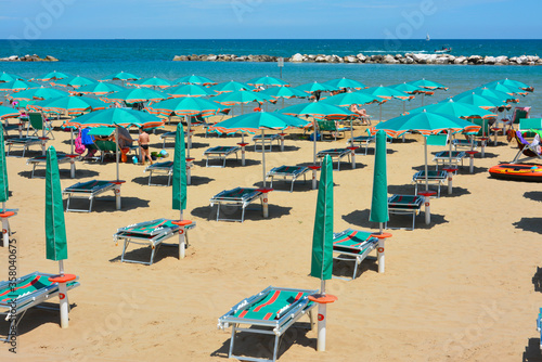 beach with umbrellas and chairs © superpapero