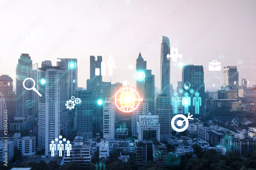 Hologram of Research and Development glowing icons. Sunset panoramic city view of Bangkok. Concept of innovative technologies to create new services and products in Asia. Double exposure. Hologram of Research and Development glowing icons. Sunset panoramic city view of Bangkok. Concept of innovative technologies to create new services and products in Asia. Double exposure.