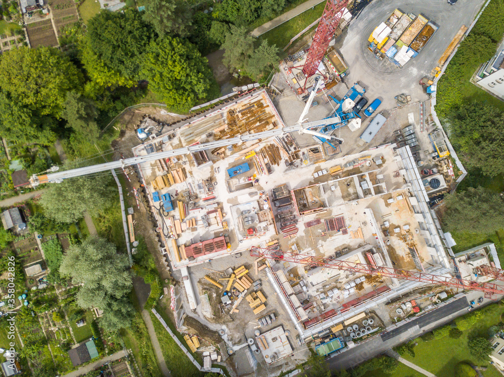 Aerial view of construction site in Switzerland with large crane. Aerial view of construction site in Switzerland with large crane.