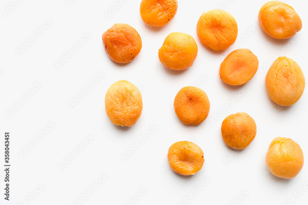 dried apricots on a white background, dried fruits dried apricots on a white background, dried fruits
