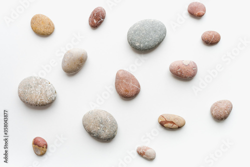 sea ​​stones on white background, background of stones, 
sea ​​stones, 