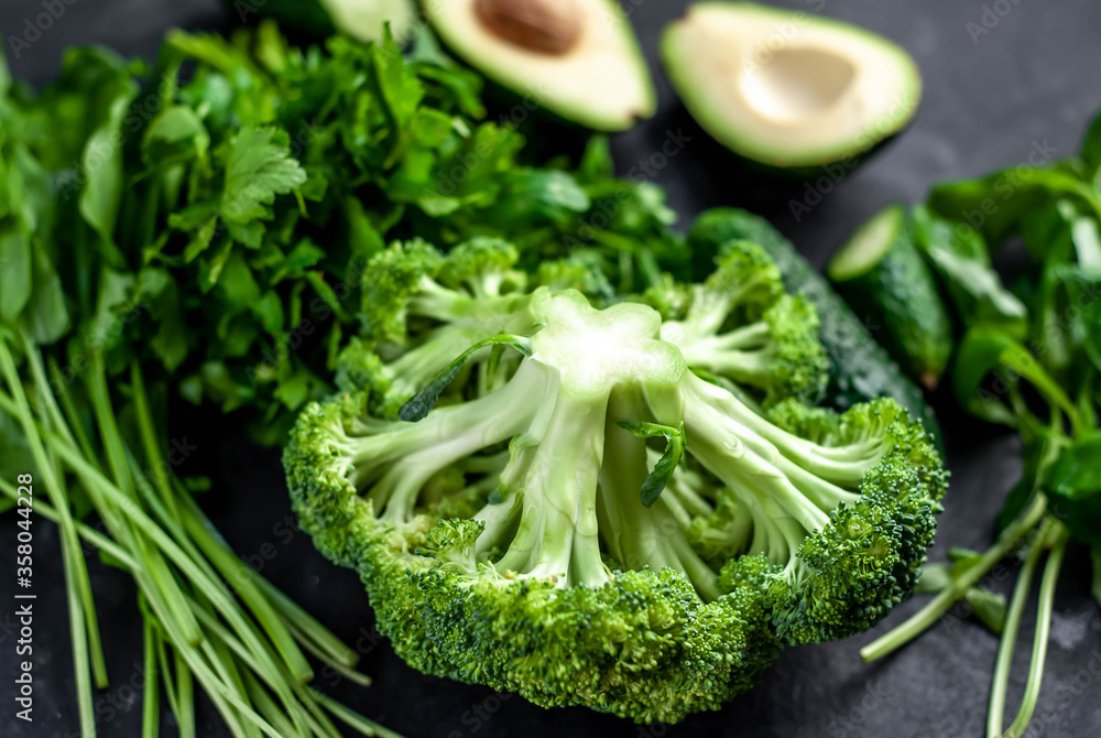 Set of raw healthy food for vegetarians: on a stone background Set of raw healthy food for vegetarians: on a stone background
