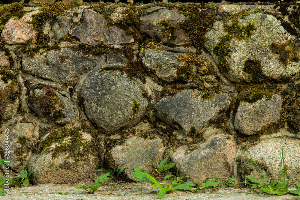 old stone wall with moss background