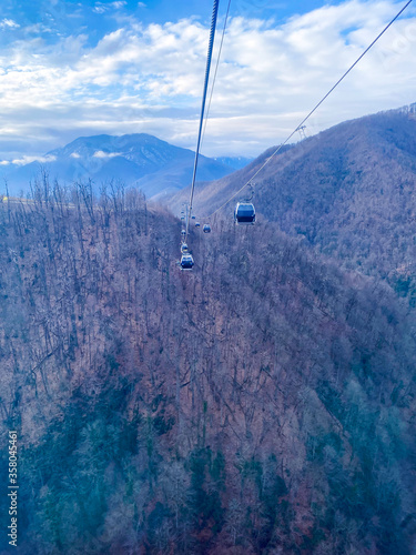 Funicular cabins on a background of a winter landscape