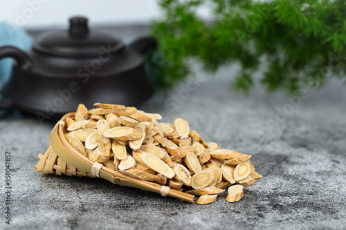 Chinese herbal medicines -- Astragalus on stone background