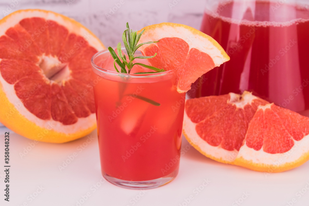 Fresh grapefruit juice in a glass. Close-up.
Fresh grapefruit juice in a glass. Close-up.