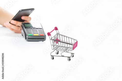 e-commerce shopping cart smartphone pay POS device and isolated on white background.