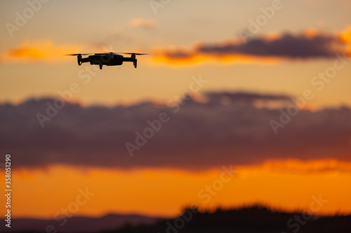 Drone against the background of the setting sun