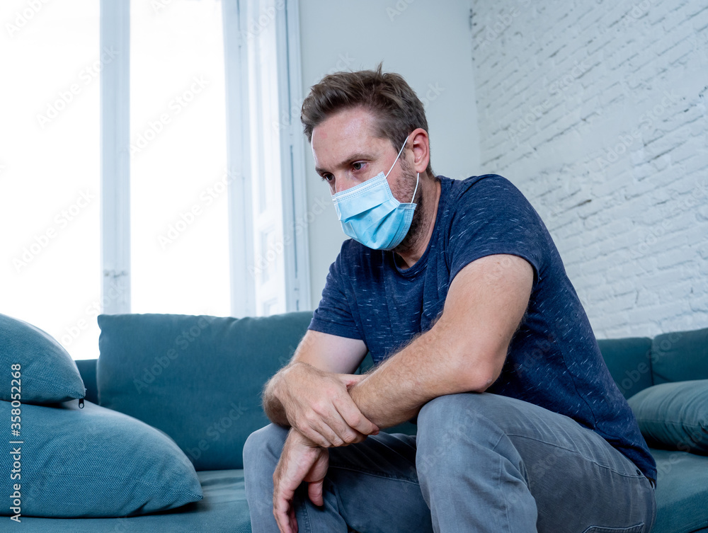 Lonely man suffering from depression at home during coronavirus lockdown and social distancing Lonely man suffering from depression at home during coronavirus lockdown and social distancing