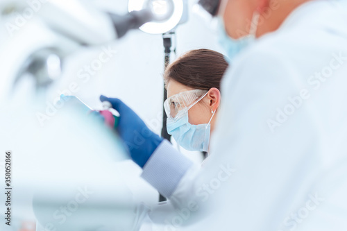 Photos background image scientists conducting research in a medical laboratory