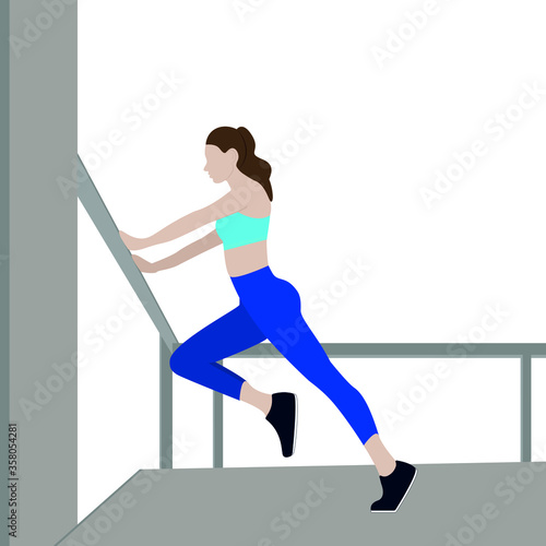 Girl goes in for sports, sport illustration. A slender girl in a blue suit does exercises near the wall, stretching is performed.