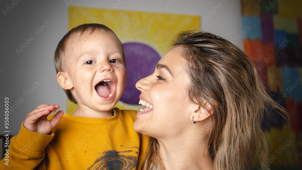 Mom and son playing silly together. Family having fun and laughing at home Mom and son playing silly together. Family having fun and laughing at home