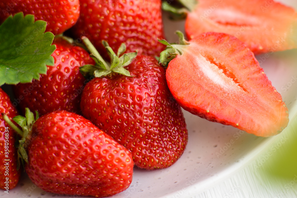 Beautiful juicy fresh strawberries on the concrete surface of the table Beautiful juicy fresh strawberries on the concrete surface of the table
