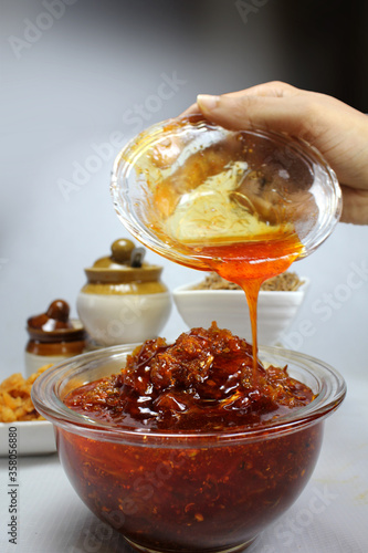 Aam Chhunda or Raw Mango Pickle is Indian side dish served with Chapati,roti or Thepla in the state of Gujarat. photo