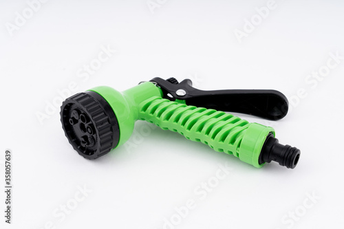 Black - Green Plastic Watering Garden Hose Sprayer Multi-functional spray gun isolated on white background.