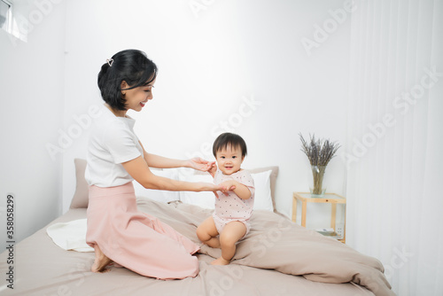 Happy loving family. Mother and her daughter child girl playing