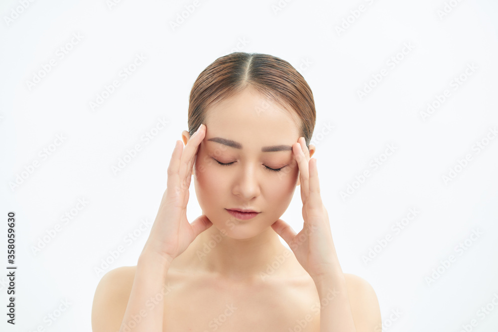Portrait of tired and upset Asian woman over white background Portrait of tired and upset Asian woman over white background