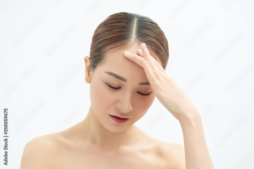 Emotional portrait of a tired and tensed young naked beautiful woman over white background. Emotional portrait of a tired and tensed young naked beautiful woman over white background.