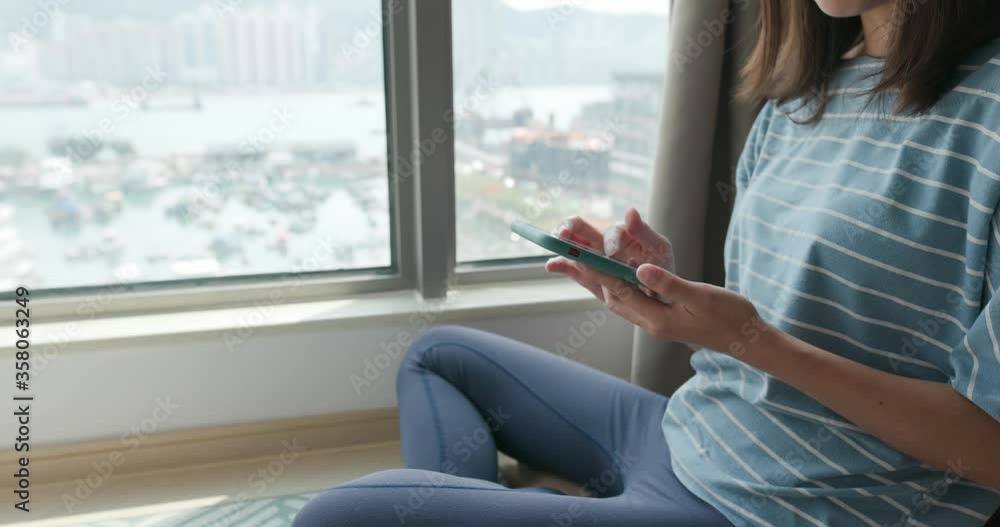 Woman use of mobile phone at home Woman use of mobile phone at home