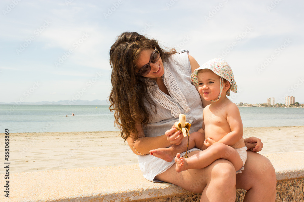 Fototapeta premium mother and baby in the beach