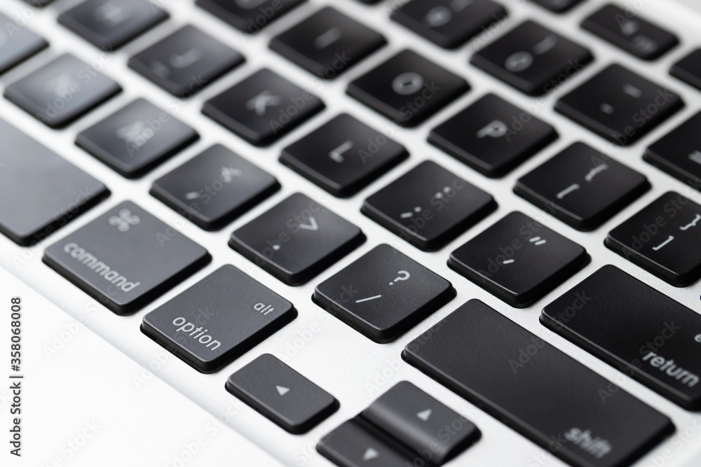 close up modern laptop, stylish computer keyboard the area. The flat trackpad can be seen in the frame. focus notebook characters. close up modern laptop, stylish computer keyboard the area. The flat trackpad can be seen in the frame. focus notebook characters.