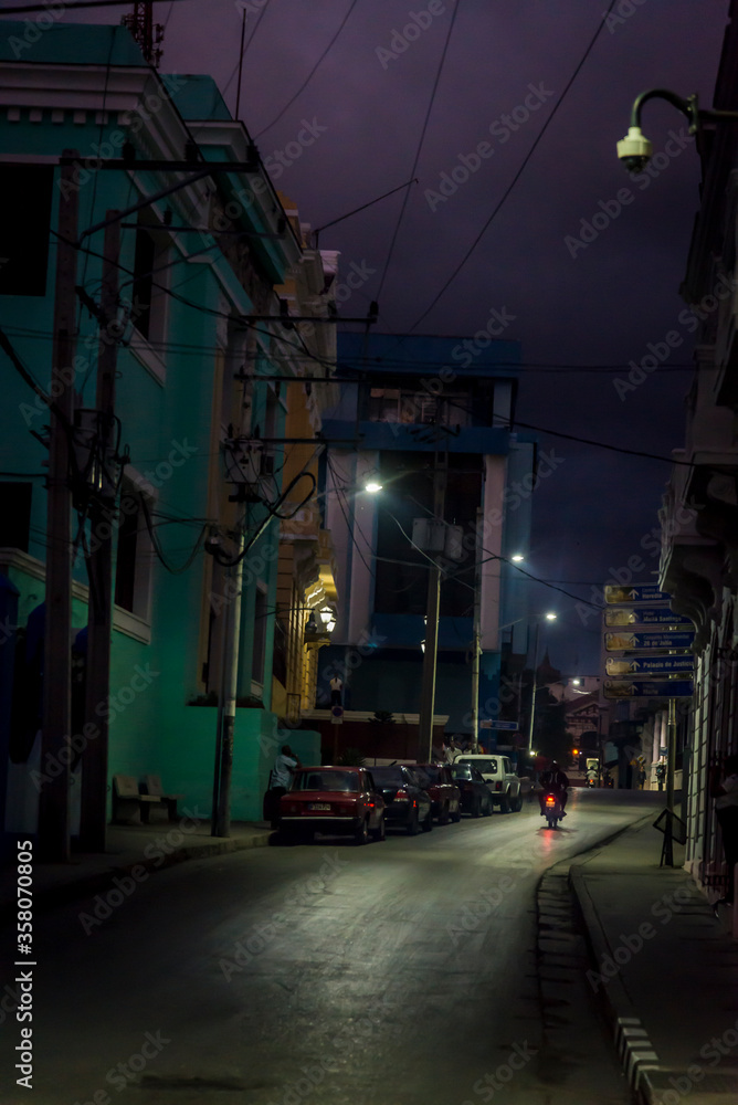 Fototapeta premium Deserted street at night in the city centre, Santiago de Cuba, Cuba
