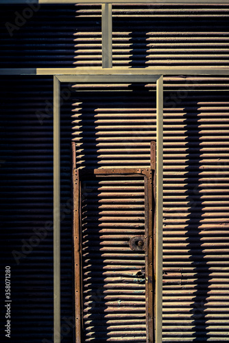 Metal corrugated door with shadows, Santiago de Cuba, Cuba