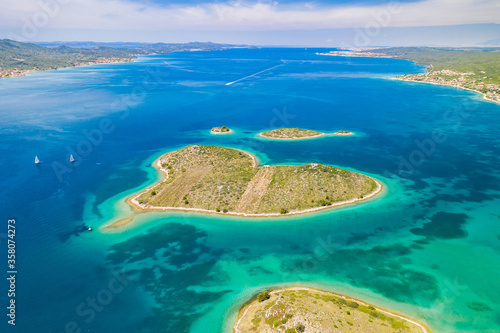 Croatia, beautiful coastline on Adriatic sea, romantic heart shaped island of Galesnjak in turquoise sea, aerial view of from drone 